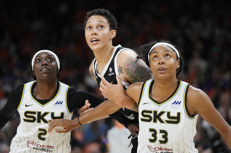 Phoenix Mercury center Brittney Griner, is boxed out by Chicago Sky guard Kahleah Copper (left) and center Kristine Anigwe  during the first half of a WNBA basketball game Sunday, May 21, 2023, in Phoenix.