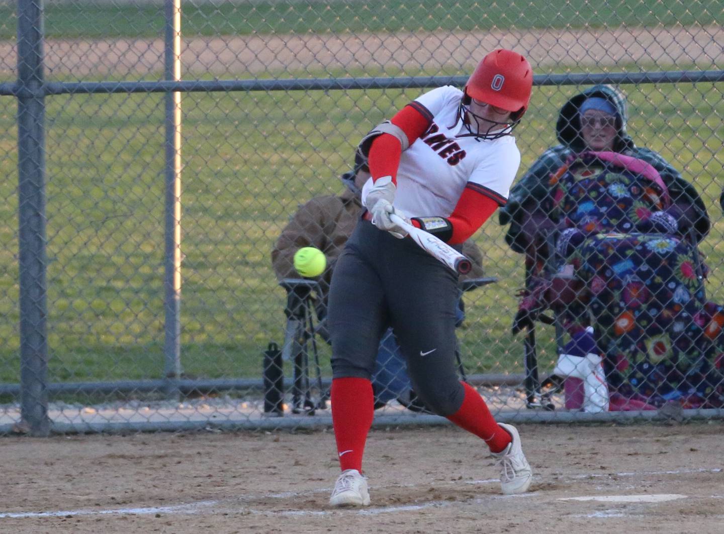 Ottawa's McKenzie Oslanzi hits a triple  against Plano on Thursday, April 6, 2023 at King Field in Ottawa.