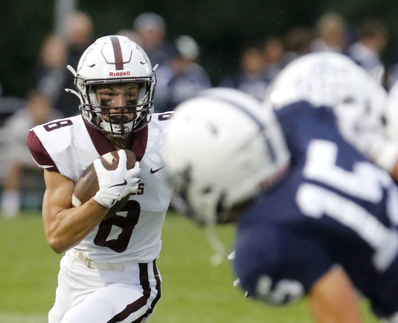 Prairie Ridge's Jesse Kautz runs with the ball during a Fox Valley Conference football game against Cary-Grove on Friday, Aug. 29, 2025, at Cary-Grove High School in Cary.