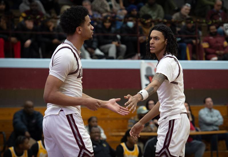 Kankakee's Lincoln Williams, right, reaches out after EJ Hazelett, left, draws a foul in a game against Richards in the Kankakee Holiday Tournament at Kankakee High School on Saturday, December 27, 2025.
