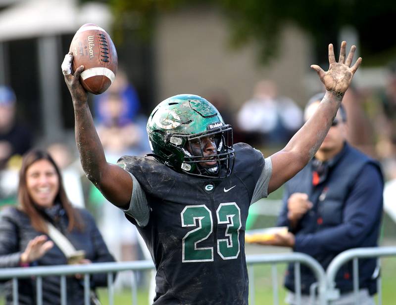 Glenbard West's Jason Thomas celebrates a touchdown during a Class 8A playoffs first-round game against Oswego in Glen Ellyn on Saturday, Oct. 30, 2021.