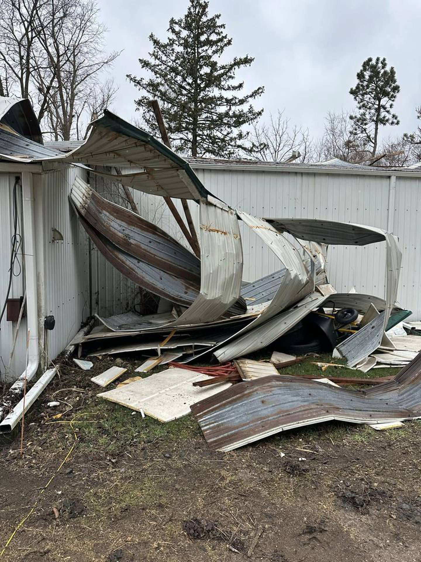The fast-moving storm blew off the northwest corner of the arena building at Huntoon Stables in North Aurora. None of the 21 horses or any people were injured and about half of the arena is still securely covered.