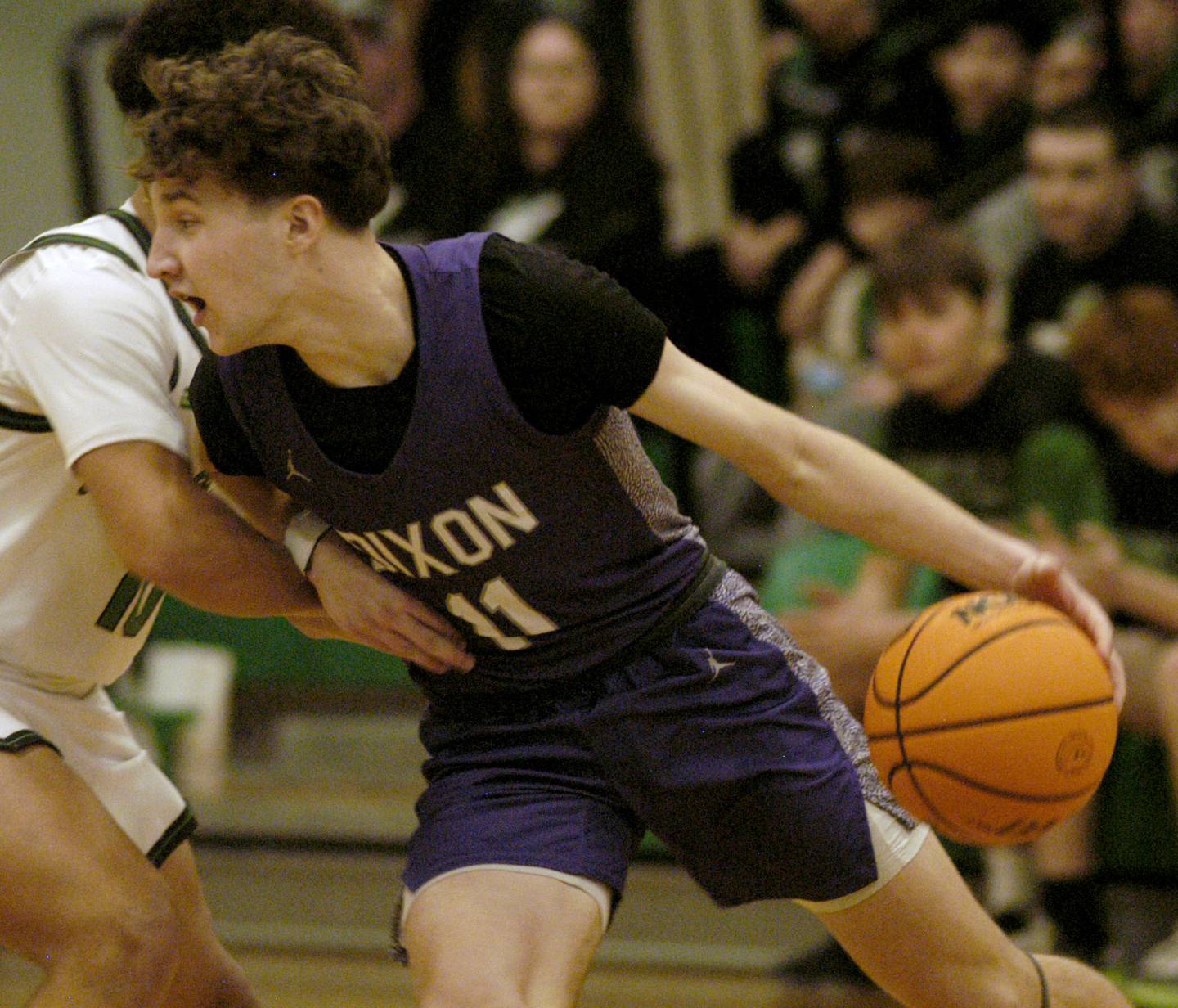 Dixon's Brody Nicklaus goes hard into Rock Fall's player Z'Viyon Martin. The Rock Falls Rockets hosedt the Dixon Dukes in a Conference basketball game. The game was held at Forest Tabor gym in Rock Falls on Friday, February 13, 2026