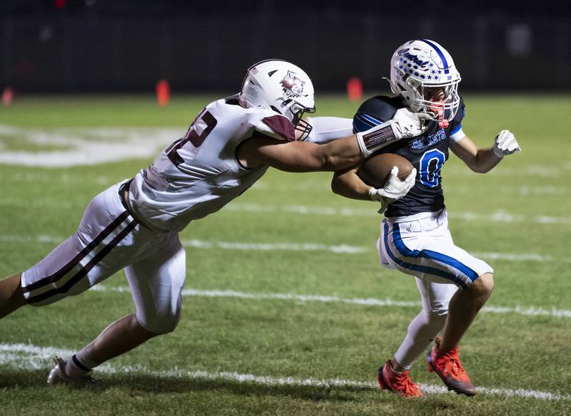 Prairie Ridge's Hunter Mosolino tackles Burlington Central's Henry Deering during their game on Friday, September 19, 2025 at Burlington Central High School. Ryan Rayburn for Shaw Local
