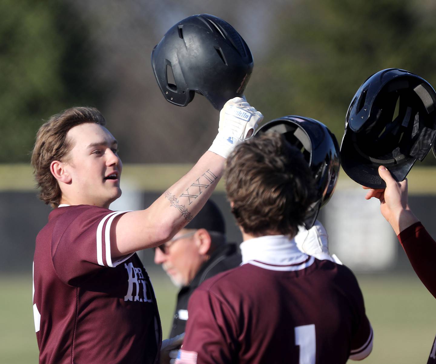 Prairie Ridge’ sGavin Piekos celebrates his two-run home run with teammates during a Fox Valley Conference baseball game against Cary-Grove on April 8, 2026, at Prairie Ridge High School.