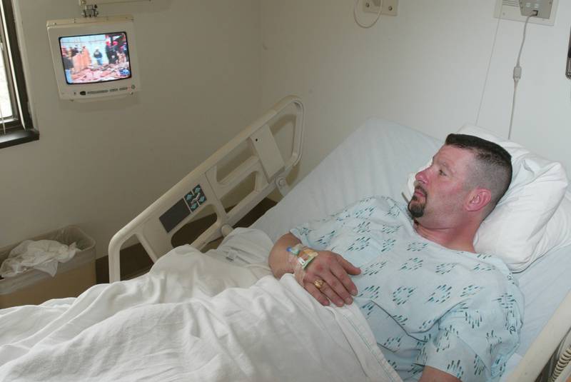 Rich Little lays in a hospital bed at Illinois Valley Community Hospital watching ABC 7 News on the Utica Tornado in 2004. Little was the first person pulled out alive from the Milestone Tavern.