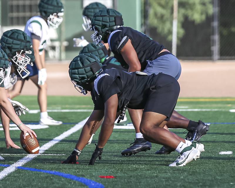 Jayden Daniel gets set in his stance at Glenbard West football practice, Wednesday, Aug 21, 2025  in Glen Ellyn.