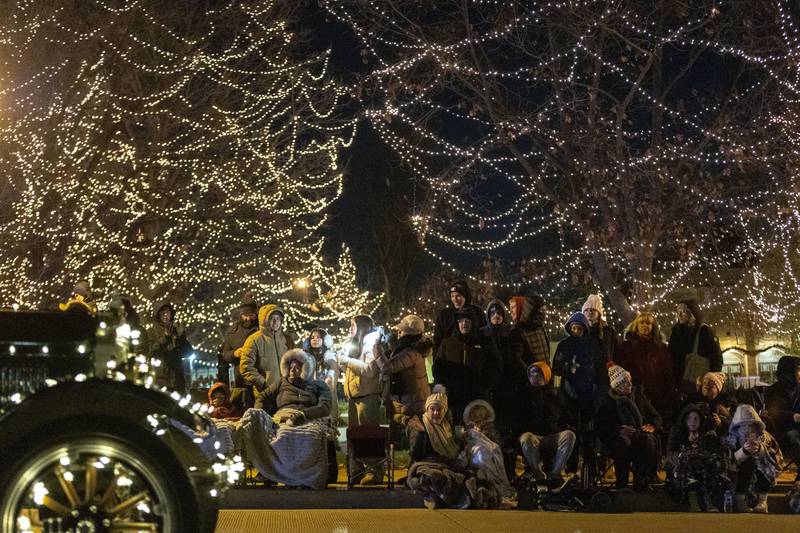 Spectators watch the Holiday Homecoming Electric Christmas Parade in St. Charles on Saturday, Nov. 30, 2024.