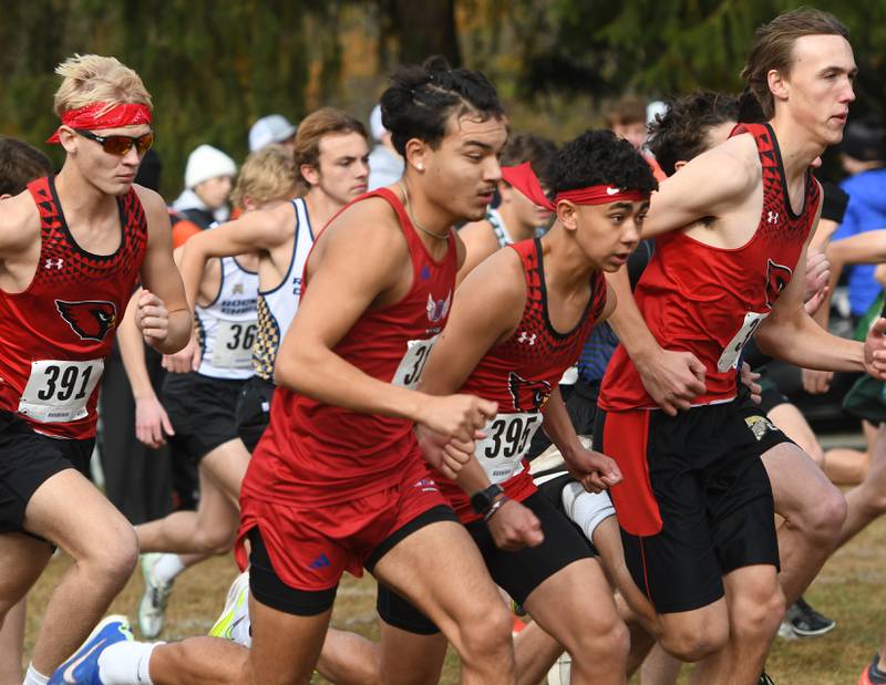 Oregon's Daniel Gonzalez (center) starts the 1A Winnebago Boys Regional on Saturday, Oct. 25, 2025 at the Levi and Ester Fuller Memorial Forest Preserve.