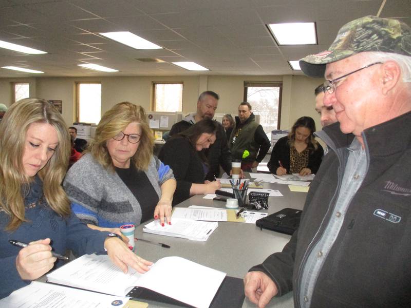 Kendall County Board member Brian DeBolt of Plano, right, files his candidate nominating petitions to run for reelection to his District 1 seat. Processing DeBolt's paperwork is Director of Elections Natalie Hisaw. (Mark Foster -- mfoster@shawmedia.com