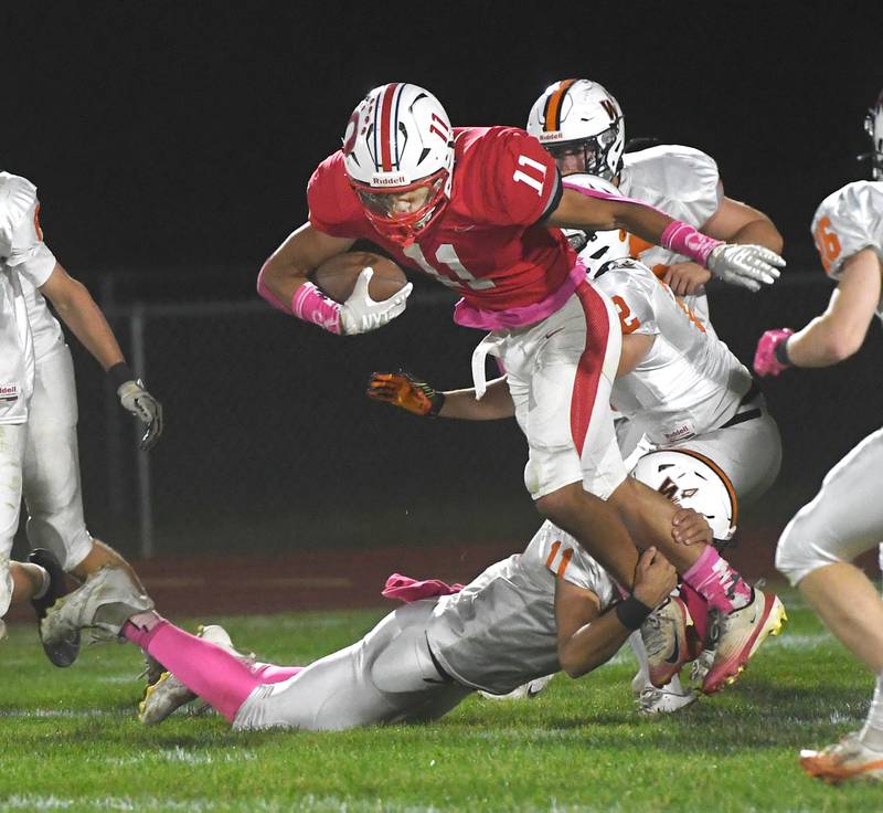 Oregon's Jayden Berry fights for yards against Winnebago on Friday, Oct. 17, 2025 at Landers-Loomis Field in Oregon.
