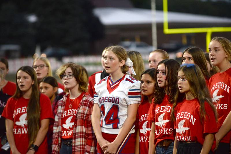 Oregon High School Choir members sing the National Anthem before the start of the 2025 Homecoming football game with Rock Falls on Friday, Sept. 19, 2025 at Landers-Loomis Field in Oregon.