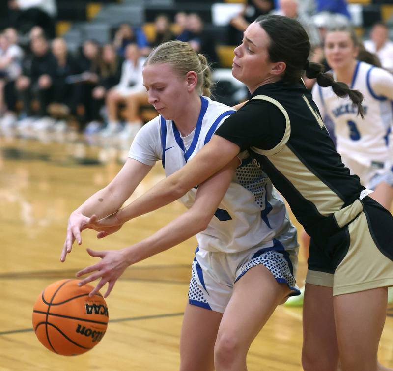 Sycamore's Layla Janisch knocks the ball away from Burlington Central's Ashley Waslo Thursday, Feb. 19, 2026, during their Class 3A regional championship game at Sycamore High School.