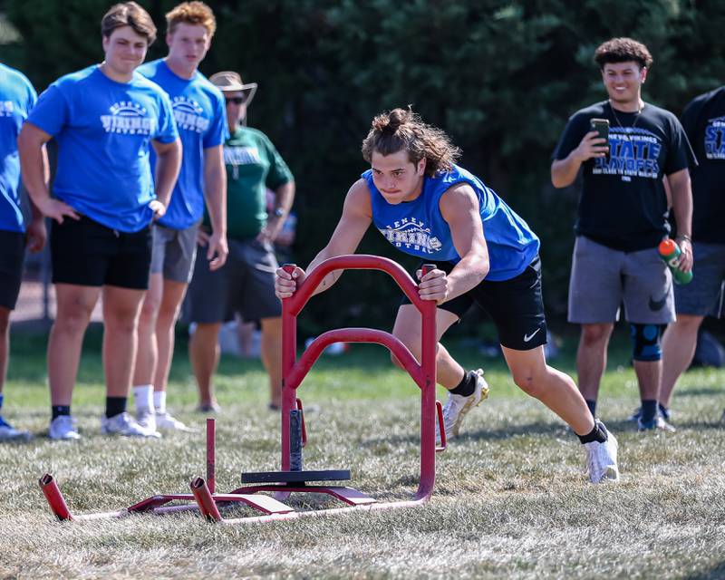 Geneva competes in agility drills at the West Aurora High School Battle of the Big Butts Linemen Challenge.  July 14, 2022.