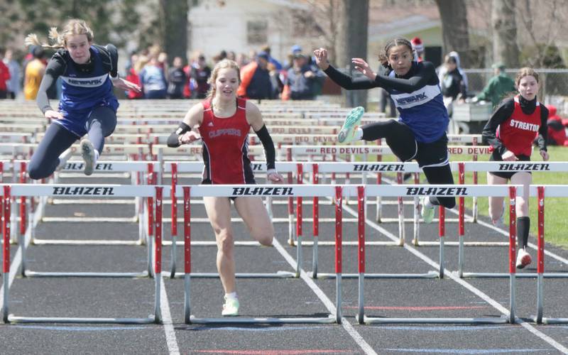 From left: Newark's Megan Williams, Amboy's Elly Jones, Newark's Kiara Wesseh, and Streator's Abby Pierce race in the girls 100 meter hurdles during the Rollie Morris Invite on Saturday, April 16, 2022 at Hall High School in Spring Valley.