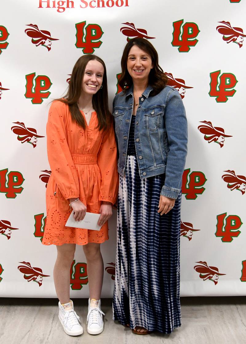 Hailey Weber (left) received the $1,000 Harry Debo Memorial Scholarship. This scholarship, named in memory of local businessman Harry Debo, is awarded to a La Salle-Peru High School senior who plans to pursue a degree in business. The scholarship was presented by Jennifer Radtke (right).