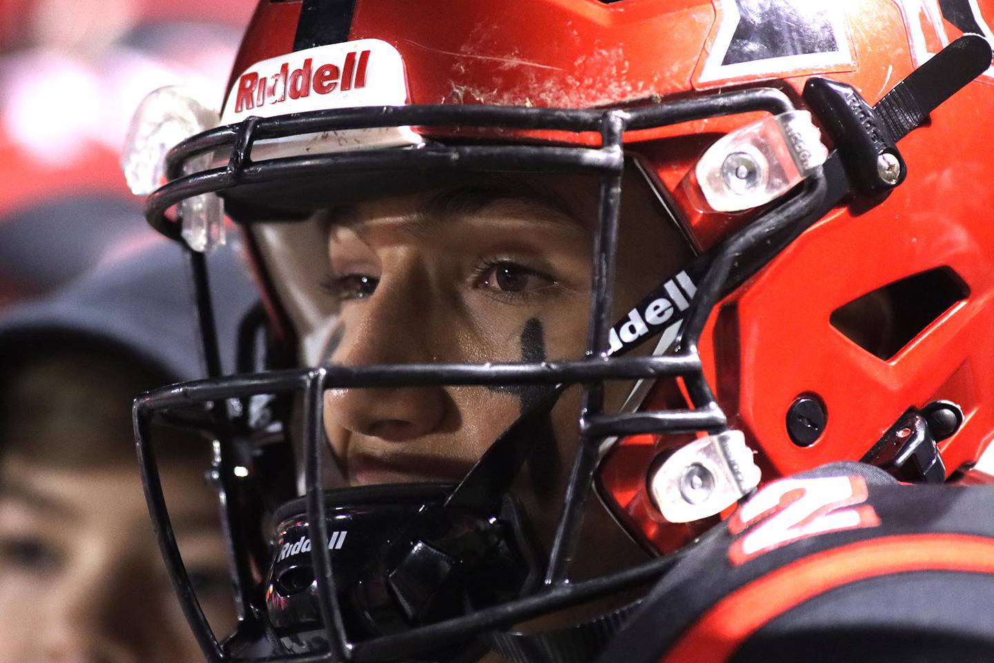 Huntley’s quarterback Sam Deligio waits on the sidelines as the Red Raider defense goes to work against Crystal Lake South in varsity football action at Huntley Friday evening.