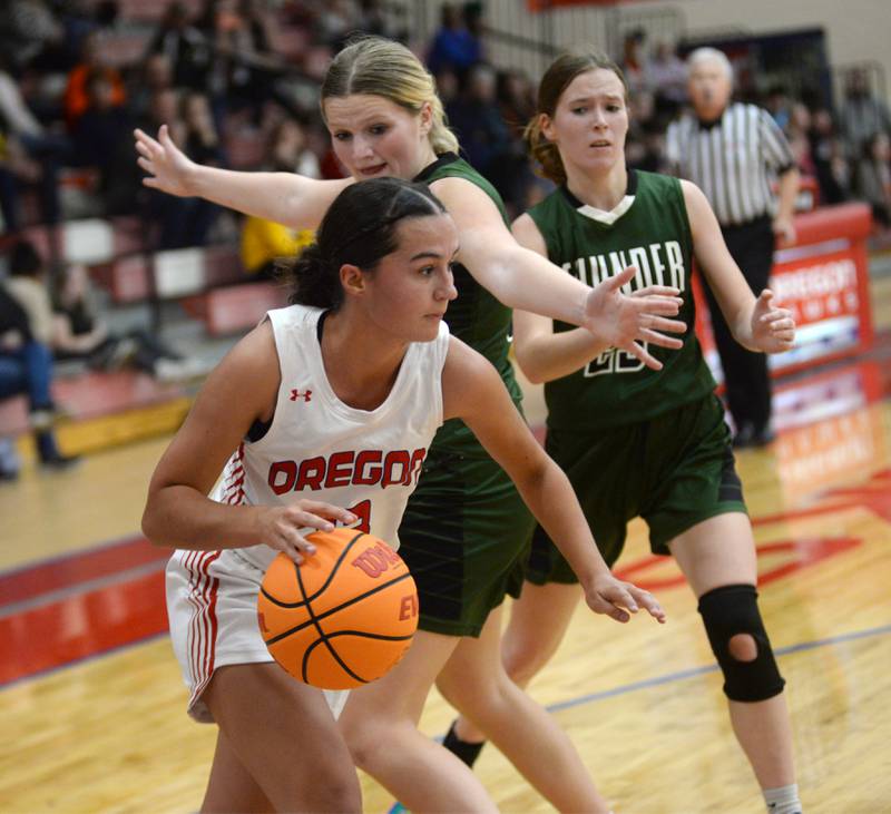 Oregon's Sarah Eckardt (13) drives the baseline against West Carroll at the Oregon Girls Basketball Tip-Off Tournament on Wednesday, Nov. 20, 2024 at the Blackhawk Center in Oregon.