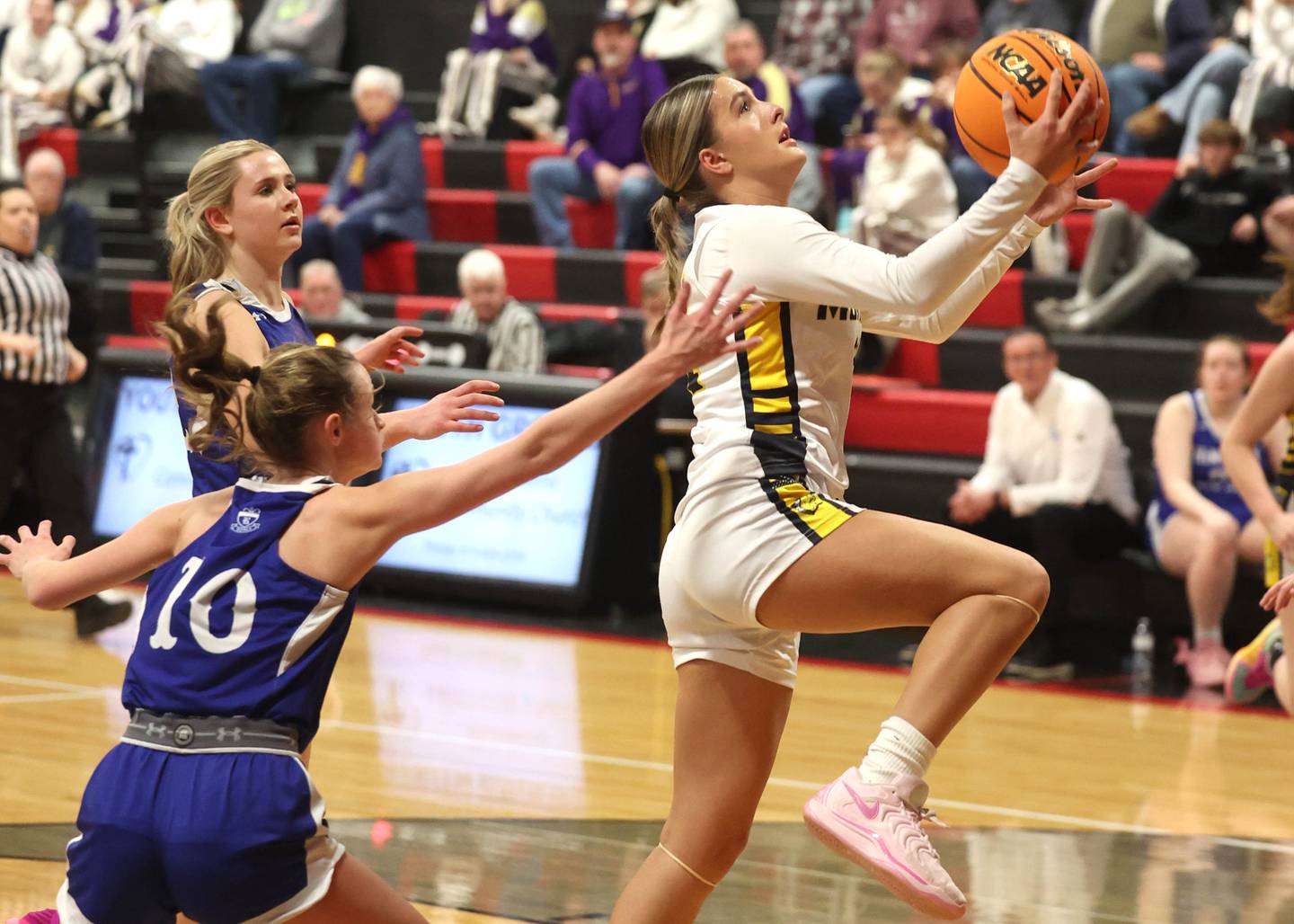 Yorkville Christian’s Danielle Bulson gets a layup in front of Hinckley-Big Rock's Grace Michaels during their Class 1A regional game Tuesday, Feb. 17, 2025, at Indian Creek High School in Shabbona.