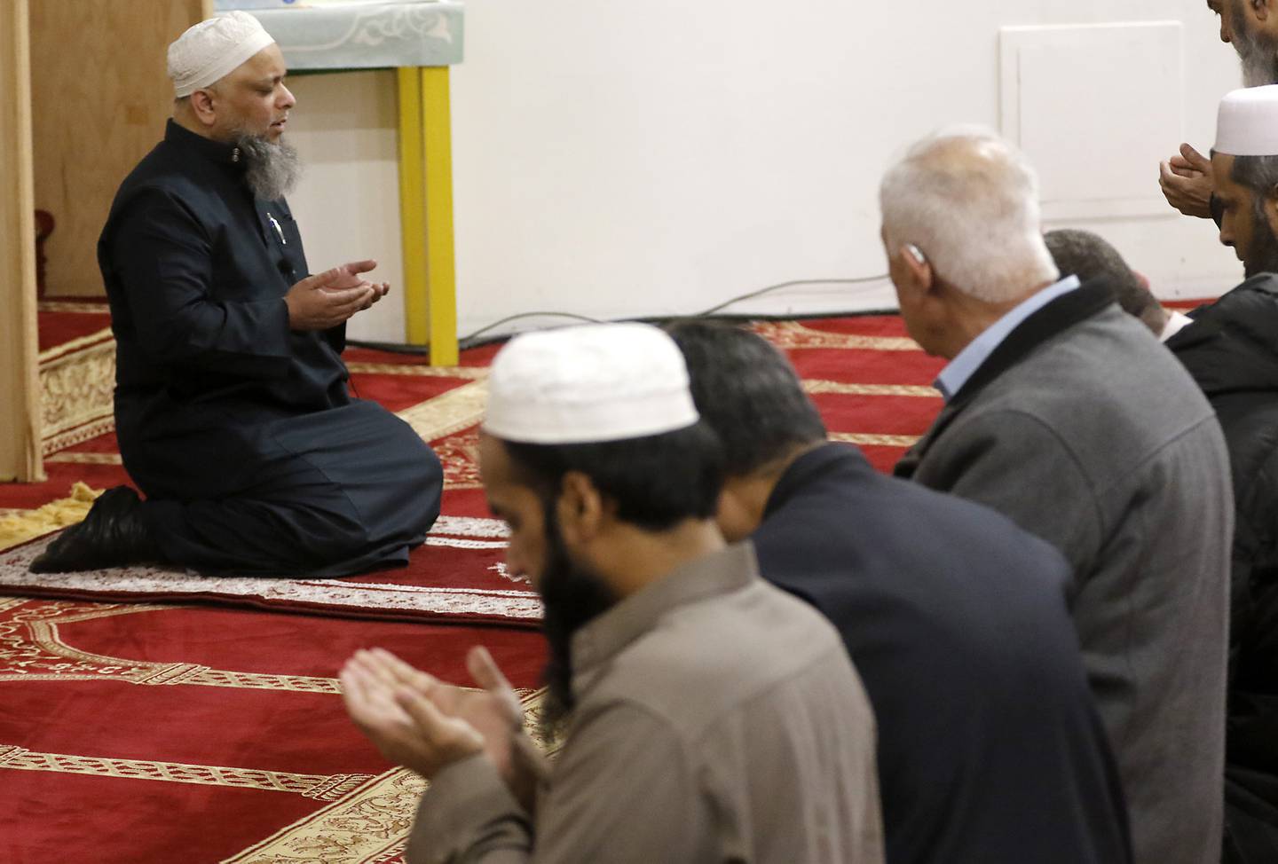 Syed Hashmi Alquadri leads members of the American Muslim Community Organization mosque in prayers Tuesday, March 29, 2023, at the organization's mosque in Lake in the Hills.