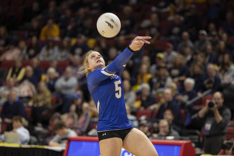 Newman’s Molly Olson plays the ball Friday, Nov. 11, 2022 in a class 1A volleyball semifinal against Aquin.