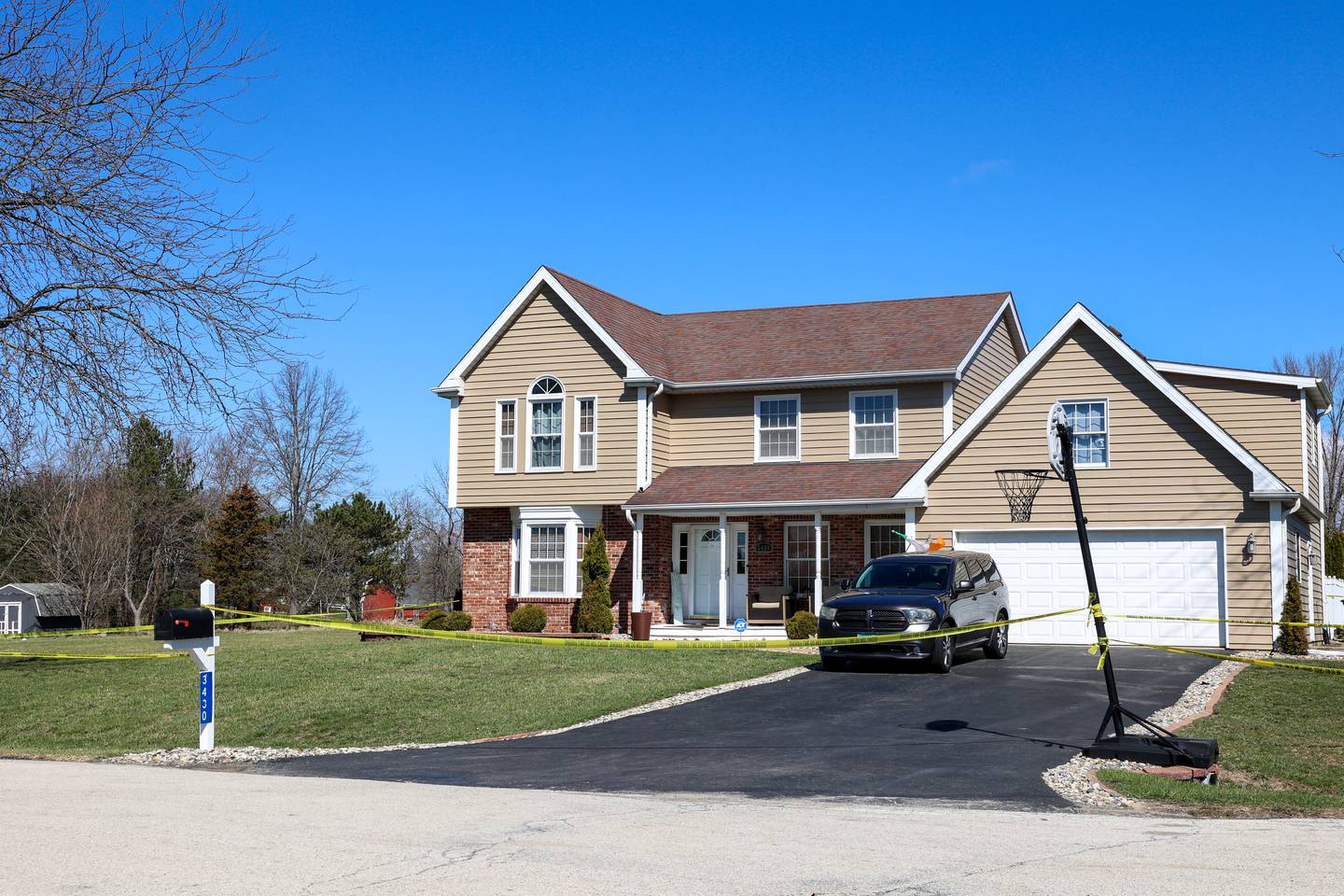 Police tape surrounds a home in the 3400 block of Norway Trail in Crete Township as the Will County Sheriff's Department investigates a triple homicide on Monday, March 23, 2026.