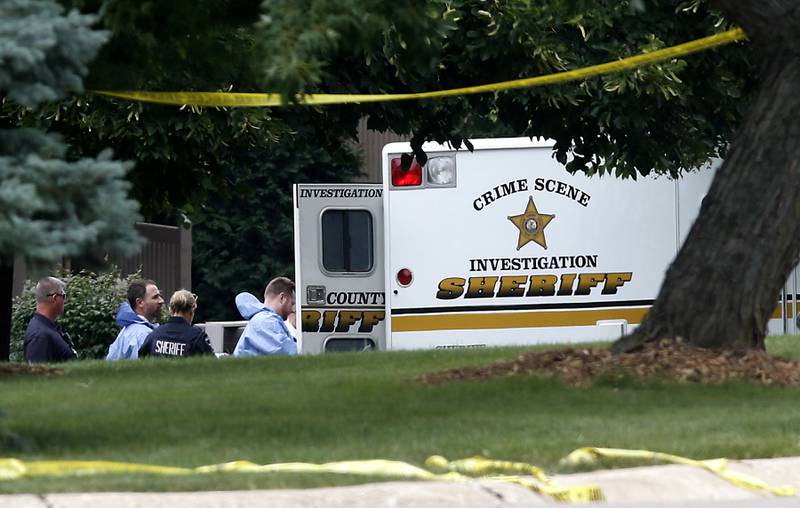 Officers from the McHenry County Sheriff and other departments investigate a domestic incident in which four people were killed, including three females and a male "aggressor," in the 5800 block of Wild Plum Road in unincorporated Crystal Lake Wednesday Aug. 9, 2023.