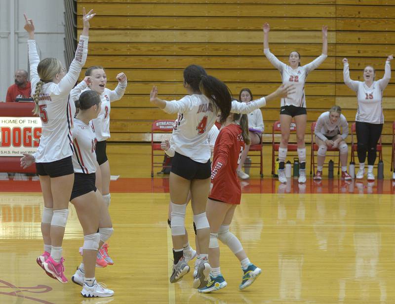 he Lady Bulldogs begin to celebrate as they win the first match against Sterling Tuesday at Streator.