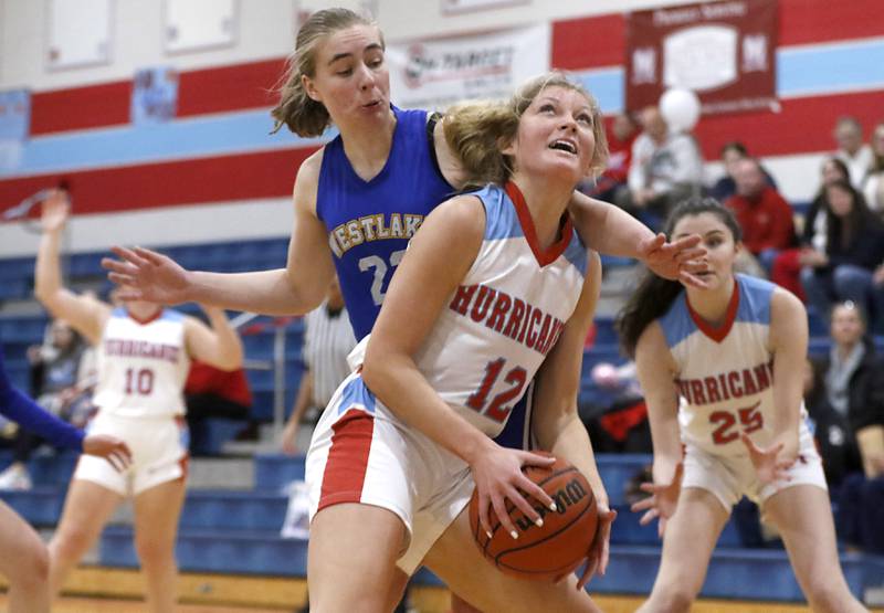 Westlake Christian’s Megan Anderson tries to guard Marian Central's Madison Kenyon during a non-conference girls basketball game Monday, Feb. 6, 2023, at Marian Central High School  in Woodstock.