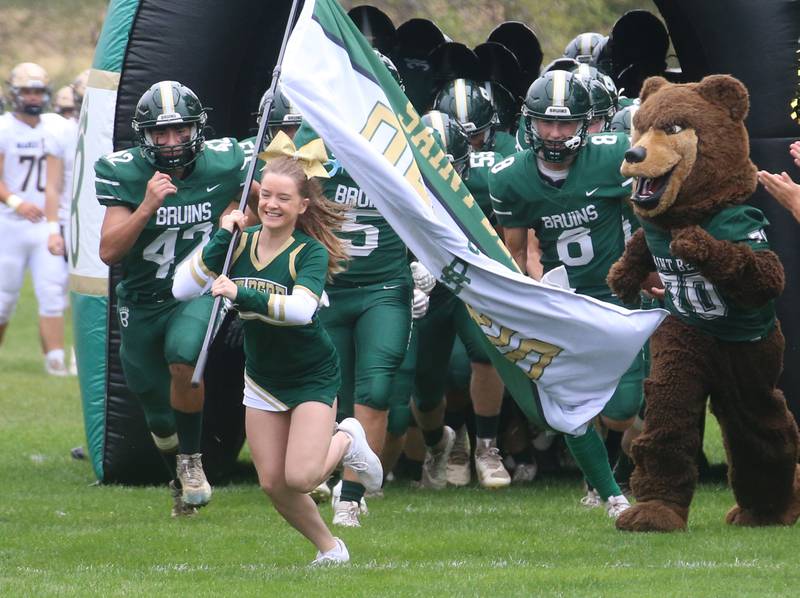 The St. Bede football team runs onto the field during the Homecoming game on Saturday, Sept. 28, 2024 at St. Bede Academy.