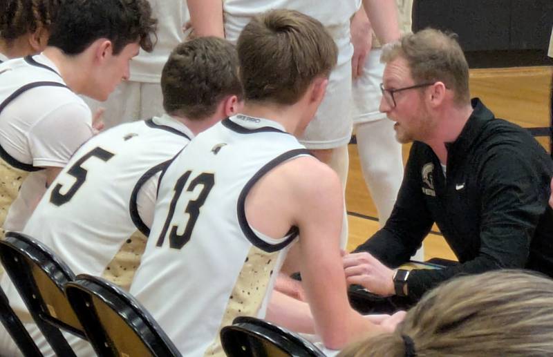 Sycamore coach Ethan Franklin talks to his team during a timeout in the Spartans' 58-53 overtime loss to Kaneland on Friday, Feb. 7, 2025.