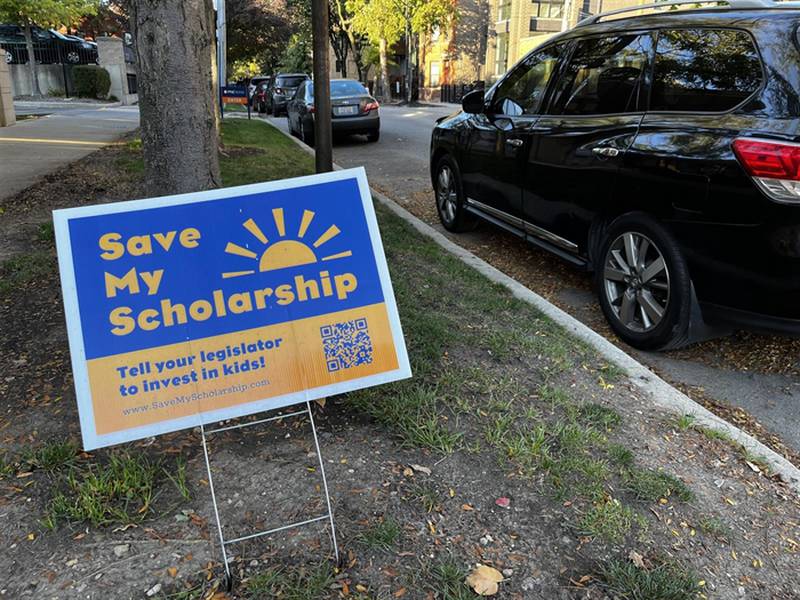 A yard sign urging Illinoisans to contact their legislators to save the “Invest in Kids” private school scholarship program is pictured in Chicago last month