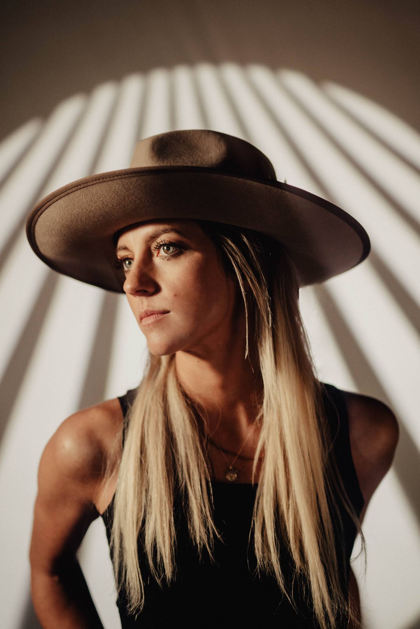 Gina Venier, a Dixon native, is finding her stride as a singer-songwriter in Nashville. Her single "Nora Jane" has been released to streaming platforms, accompanied by an interview with People magazine and a main stage performance at the Nashville Pride festival.