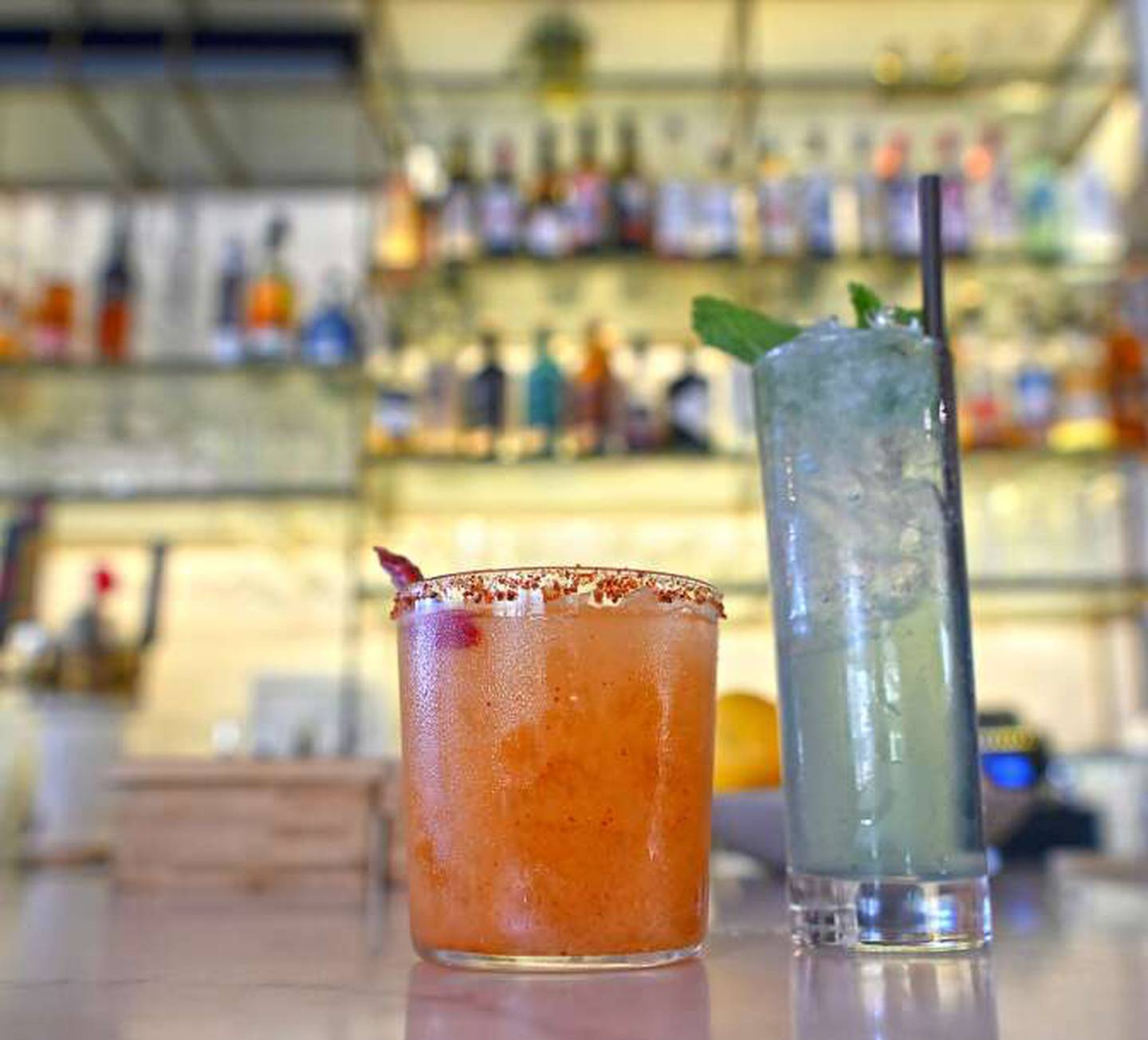 Mockingbird Bar + Garden has a robust cocktail list that includes The Spicy Mushu, left, and the The Glass Slipper.