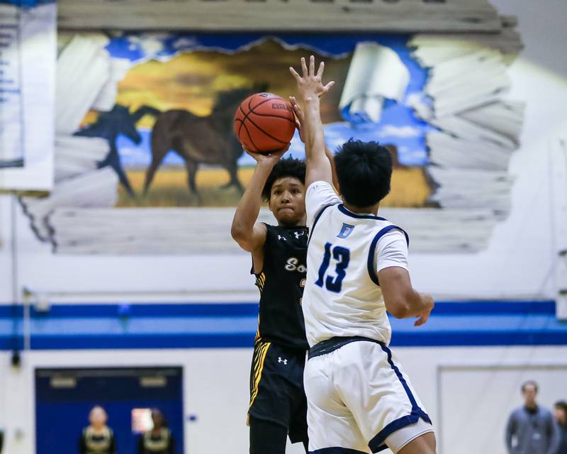 Hinsdale South's Adam Flowers (3) shoots a jump shot during basketball game between Hinsdale South at Downers Grove South. Dec 1, 2023.