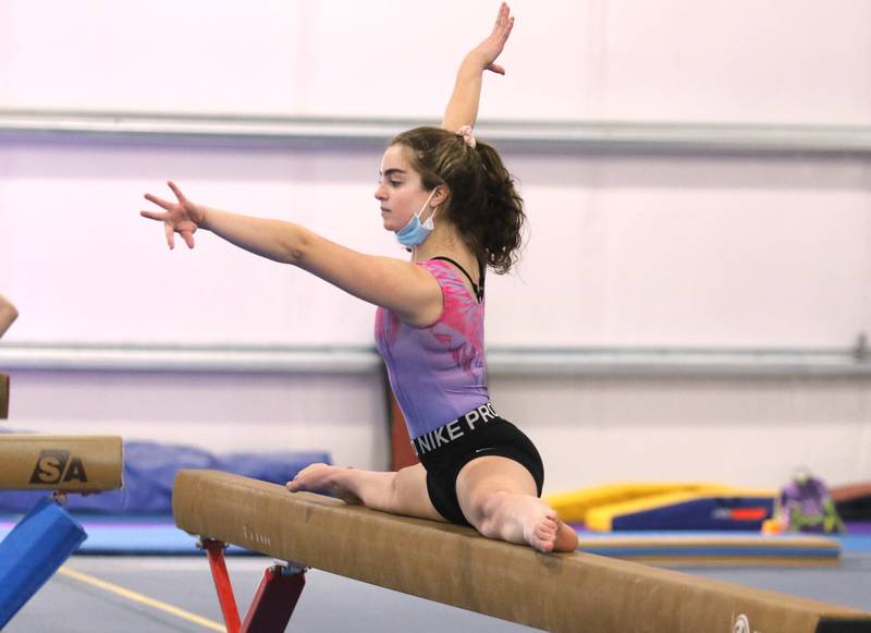 DeKalb-Sycamore co-op gymnastics freshman Joscelyn Dieckman works on the beam Wednesday during practice at Energym in Sycamore.