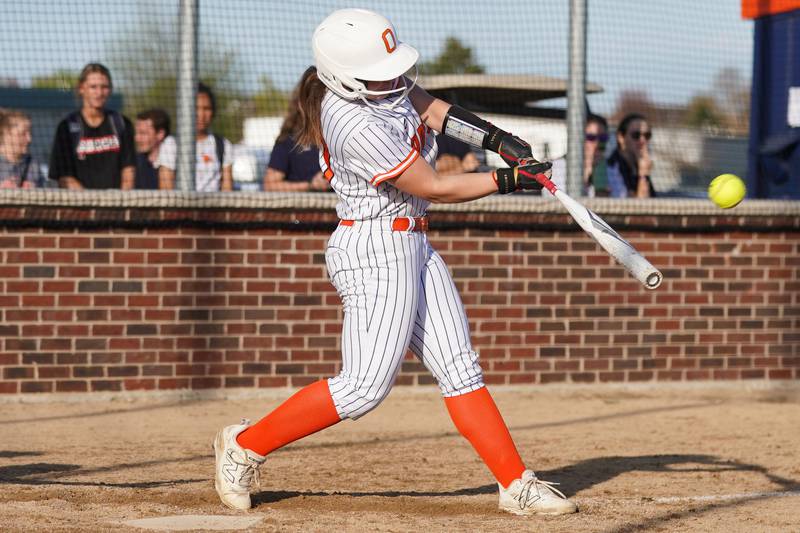 Oswego’s Leah McKenzie (13) doubles against Minooka during a Southwest Prairie Conference softball game at Oswego High School on Wednesday, April 23, 2025.