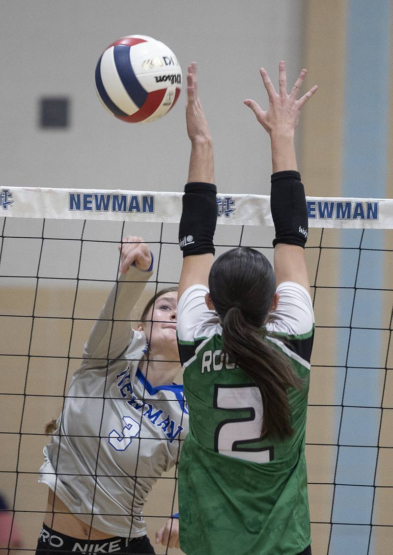 Newman’s Lauren McClain spikes against Rock Falls’ Kaltrina Lecaj Monday, Oct. 28, 2024, during regional play at Newman.
