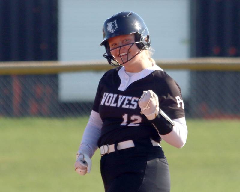 Prairie Ridge’s Bella Moore pumps her fist as she pulls into second base with a double in varsity softball at Huntley High School in Huntley on Monday, May 5, 2025.