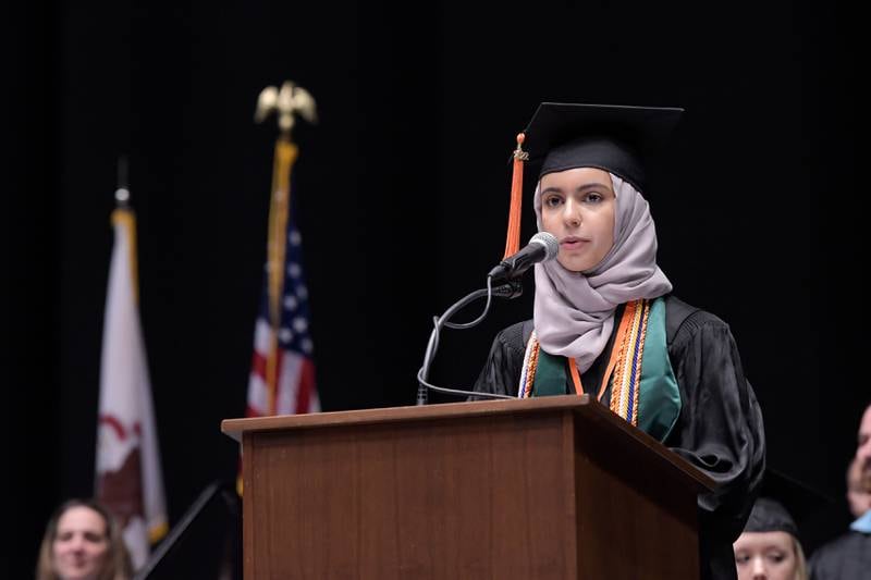 Mawaiah Alhossaini gives her Commencement Address during the DeKalb High School graduation ceremony at the Convocation Center in DeKalb on Saturday, May 28, 2022.
