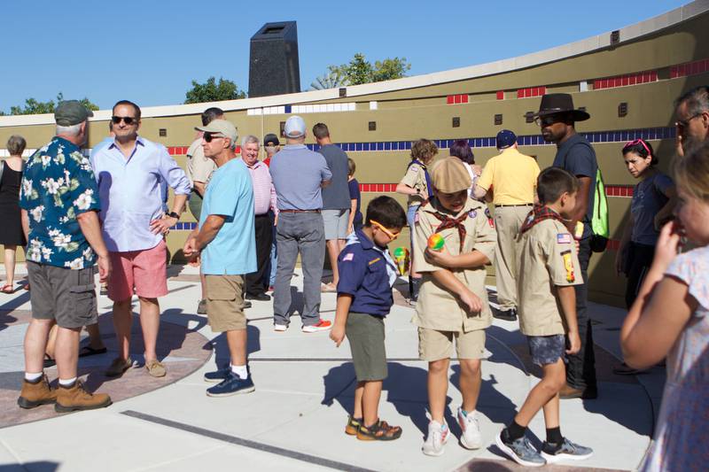 Patriot's enjoy the Flag Day Monument after opening ceremony's at Patriot's Park on Sunday, Oct 1,2023 in Batavia.