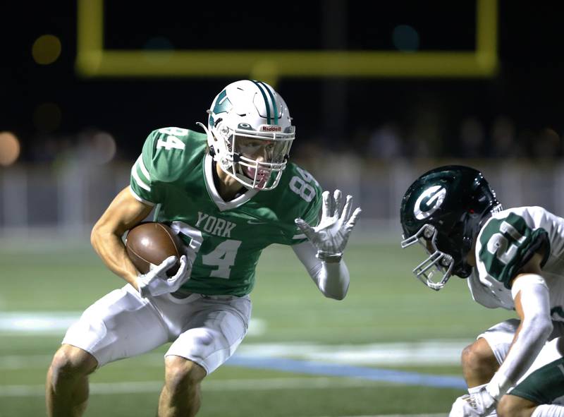 York's Luke Mailander (84) runs the ball during the boys varsity football game between York and Glenbard West on Friday, Sept. 30, 2022 in Elmhurst, IL.