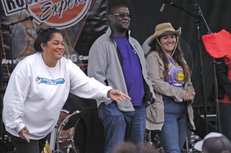 Daniela Wetzell of Sterling Fence tosses shirts to the crowd at River Country 101.7's Summer Kickoff. The event was held on the Dixon Riverfront June 1, 2024.