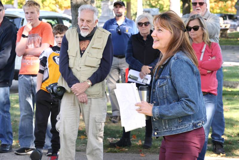 DeKalb County History Center Executive Director Michelle Donahoe guides visitors through Elmwood Cemetery in Sycamore Sunday, Oct. 9, 2022, during the Etched in Stone cemetery walk. The event, hosted by the DeKalb County History Center, told the stories of some local individuals who are buried there.