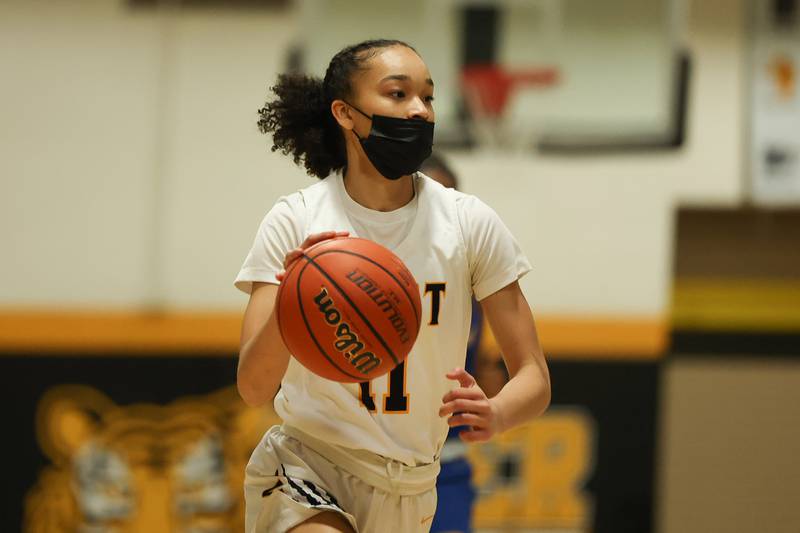 Joliet West’s Caiside Snapp looks for a play against Joliet Central. Tuesday, Feb. 8, 2022, in Joliet.