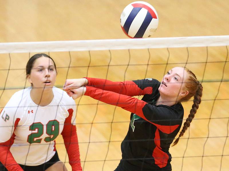 L-P's Addison Duttlinger hits the ball as teammate libero Marissa Sanchez watches from behind on Tuesday, Aug. 22, 2023 in Sellett Gymnasium.