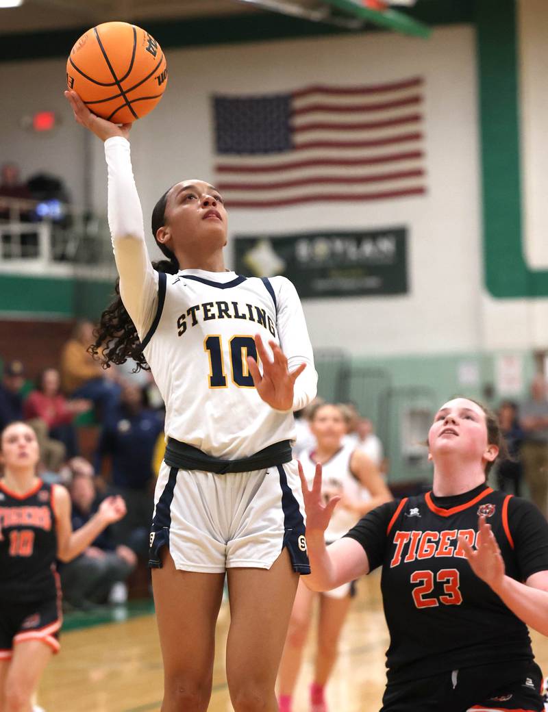Sterling's Nia Harris gets to the basket in front of Crystal Lake Central's Leah Spychala during their Class 3A sectional semifinal game Tuesday, Feb. 25, 2025, at Boylan Catholic High School in Rockford.