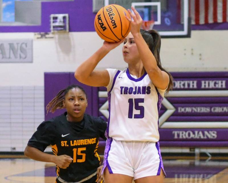 Downers Grove North's Adysen Fanta (15) makes a basket during the 4A regional championship game while taking on St. Laurence on Thursday Feb. 19, 2026, held at Downers Grove North High School.
