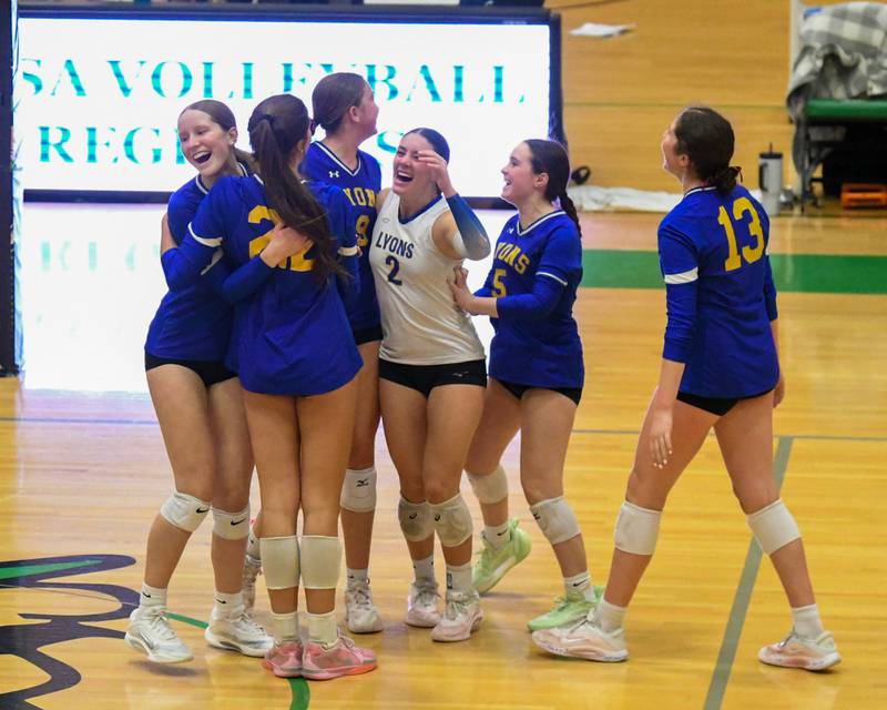 Lyons Township’s volleyball team is all smiles as they took the win over York in the reingal title game on Thursday Oct. 30, 2025, held at York High School.