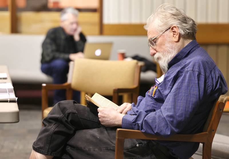 Election judges Alan Potkin (left) and Frank Adams-Waters try to pass the time while waiting for voters to arrive on Election Day Tuesday, April 4, 2023, at the polling place in Westminster Presbyterian Church in DeKalb. Morning voter turnout at that location was very low. Only two ballots had been cast as of 11:15 a.m. Tuesday.